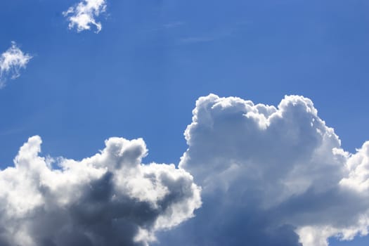 Fantastic soft white clouds against blue sky