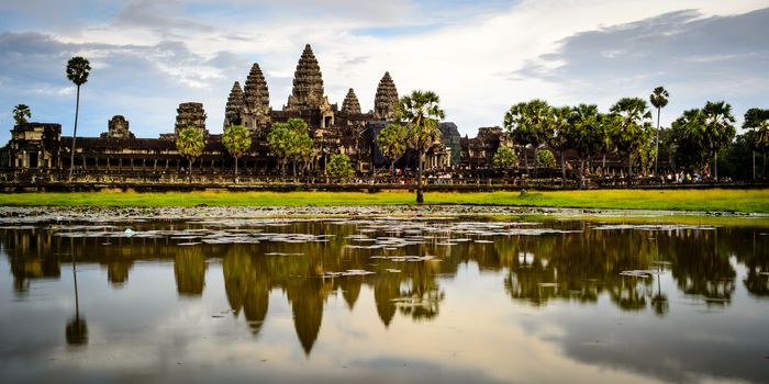 Reflection of Angkor Wat temple on the lake, at Siem Riep province, Cambodia in September 2014