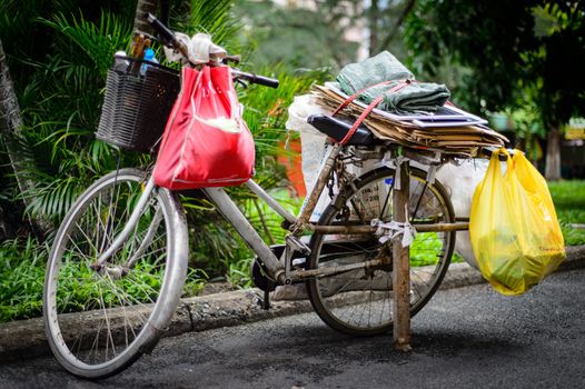 HOCHIMINH - JULY 7: Bicycle is means of livelihood, get reusable waste from public trash July 7, 2014 Hochiminh city, Vietnam