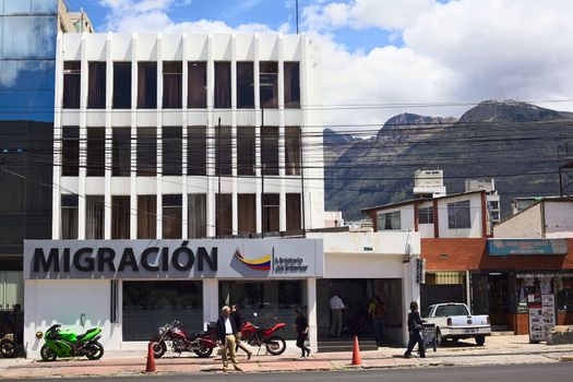 QUITO, ECUADOR - AUGUST 4, 2014: Unidentified people in front of the Migracion (Migration office) building on Amazonas Avenue on August 4, 2014 in Quito, Ecuador