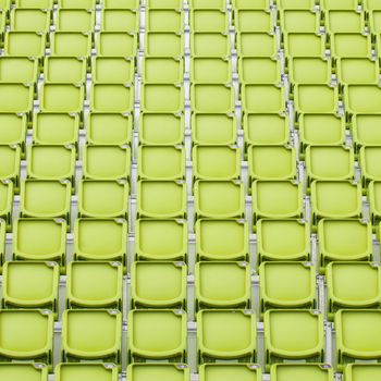 Yellow seat in sport stadium, empty seats ready for the public