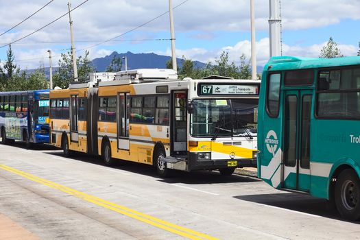 QUITO, ECUADOR - AUGUST 8, 2014: Trolleybus of the local public transportation system standing outside the Quitumbe Terminal Terrestre (long-distance bus terminal) on August 8, 2014 in Quito, Ecuador