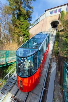 Graz, Austria - January 16, 2011:  Modern funicular climbing to Schlossberg and Graz city panoramic view, Austria