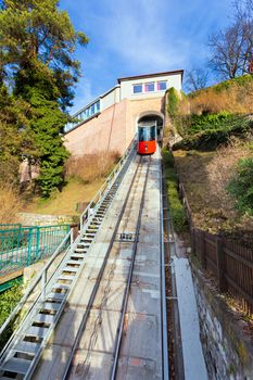 Graz, Austria - January 16, 2011:  Modern funicular climbing to Schlossberg and Graz city panoramic view, Austria