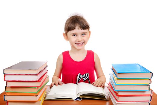 Cheerful Little Girl with the Books at the Desk on the White Background