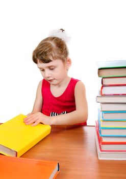 Little Girl with the Books at the Desk on the White Background