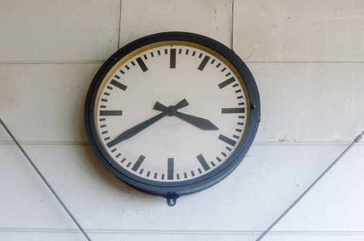 Normal Classic large wall clock in a factory.