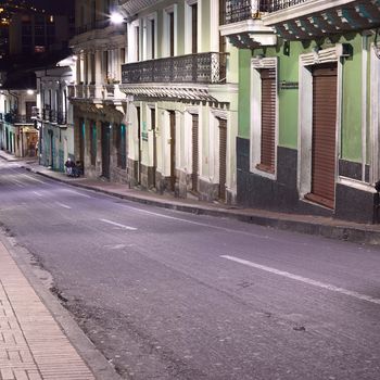 QUITO, ECUADOR - AUGUST 8, 2014: Venezuela street in the historic city center photographed at night on August 8, 2014 in Quito, Ecuador. Quito is an UNESCO World Cultural Heritage Site. 