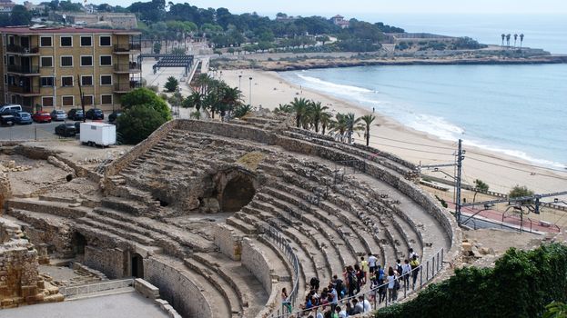 Colosseum in Tarragona, sandy beach and the sea