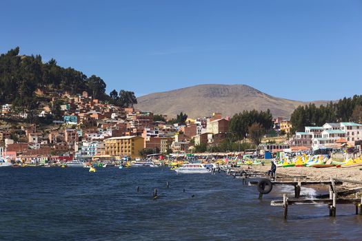 COPACABANA, BOLIVIA - OCTOBER 18, 2014: The shoreline of the small town of Copacabana along Lake Titicaca on October 18, 2014 in Copacabana, Bolivia. Copacabana is a popular tourist destination and starting point for tours to Isla del Sol (Island of the Sun).