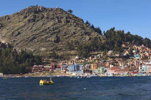 COPACABANA, BOLIVIA - OCTOBER 18, 2014: The shoreline of the small town of Copacabana along Lake Titicaca on October 18, 2014 in Copacabana, Bolivia. Copacabana is a popular tourist destination and starting point for tours to Isla del Sol (Island of the Sun).
