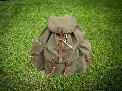 adventure backpack on green grass