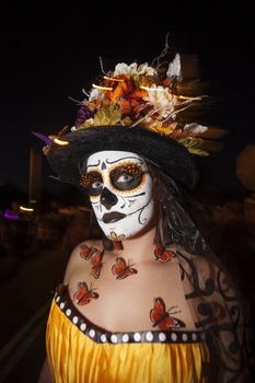 TUCSON, AZ/USA - NOVEMBER 09: Unidentified young woman with facepaint and butterfly adornments at the All Souls Procession on November 09, 2014 in Tucson, AZ, USA.