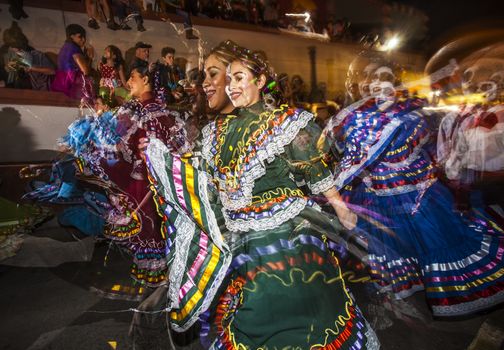 TUCSON, AZ/USA - NOVEMBER 09: Effect shot of unidentified folklorico dancers at the All Souls Procession on November 09, 2014 in Tucson, AZ, USA.