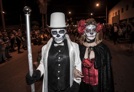 TUCSON, AZ/USA - NOVEMBER 09: Two undientified people walking in the All Souls Procession on November 09, 2014 in Tucson, AZ, USA.