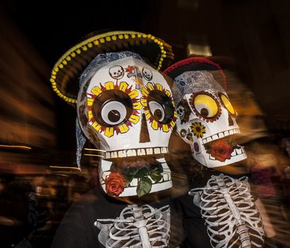 TUCSON, AZ/USA - NOVEMBER 09: Two unidentified people in large masks in the All Souls Procession on November 09, 2014 in Tucson, AZ, USA.