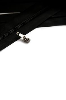 Black clothing zipper isolated on white background