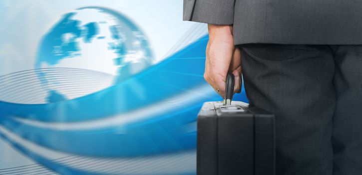 Businessman holding briefcase against global business graphic in blue