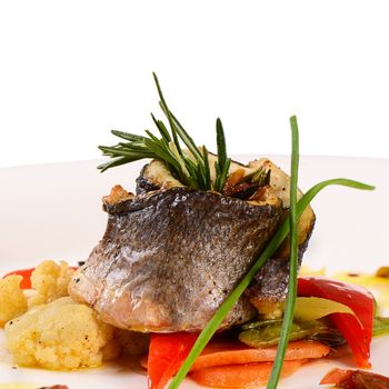Seabass fillet with spring vegetables and sauce