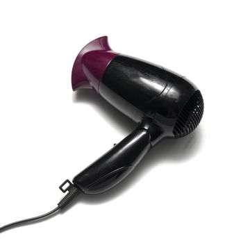 old used electric hair dryer on a white background