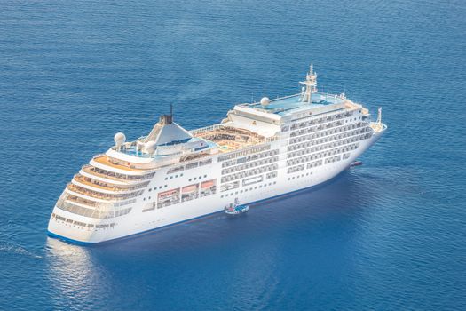 Luxury cruise ship sailing in Mediterranean sea.