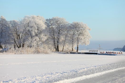 Winter landscape with frozen lake
