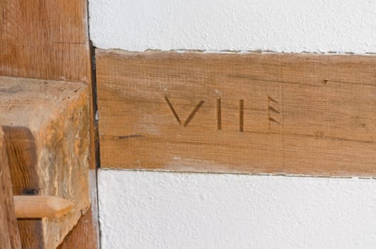 Close-up of half-timbered house, medieval house wall plastered with clay.