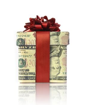 Gift box wrapped with dollar banknotes with a red ribbon 