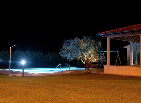 swimming pool at night, under lights