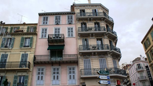 Ancient houses in Cannes with balconies, colorful
