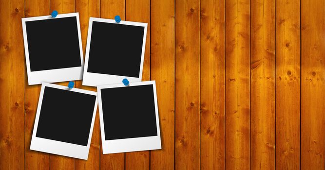 Four blank photo frames with push pin, shadow and empty space for your photograph, picture and copy on brown wooden grunge brown background.