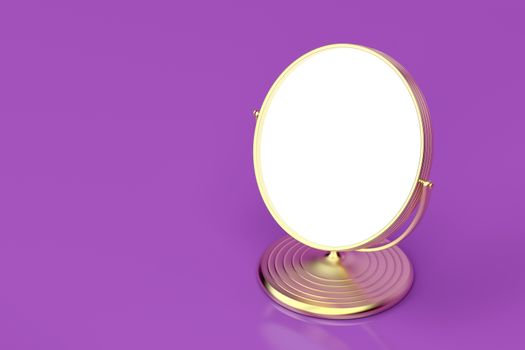 Gold makeup mirror on shiny purple background 