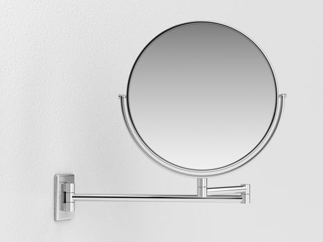 Silver makeup mirror on white wall 