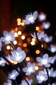 garland from blue and yellow bulbs in the form of flowers