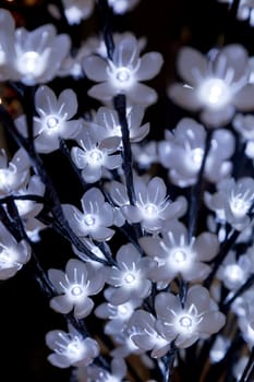 garland from blue and yellow bulbs in the form of flowers