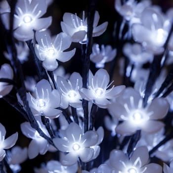 garland from blue and yellow bulbs in the form of flowers