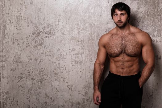 Bodybuilder. Man with hairy chest