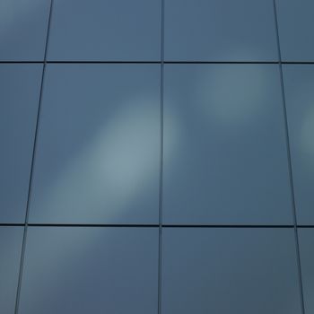 Modern minimalist building against clear blue sky