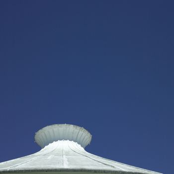 White cement building top and clear blue sky