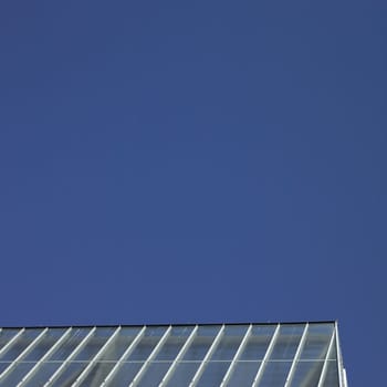 Greenhouse rooftop and clear blue sky