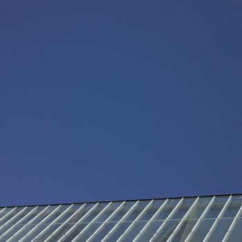 Greenhouse rooftop and clear blue sky