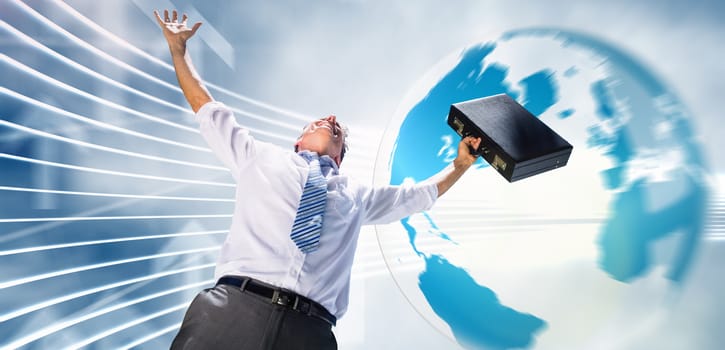 Businessman holding briefcase and cheering against global business graphic in blue