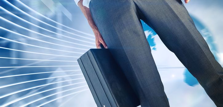 Businessman holding briefcase against global business graphic in blue