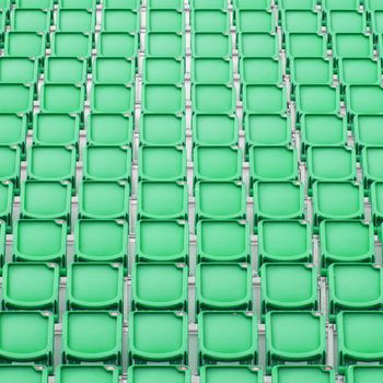 Green seat in sport stadium, empty seats ready for the public