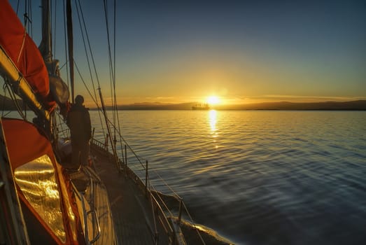 Scenic sunrise viewed from yacht over the coast of Chile in South America               