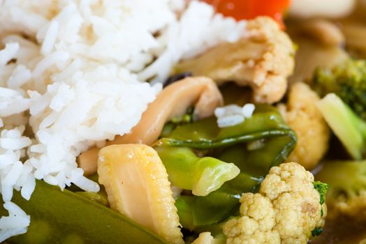 Dish of rice with vegetables in sweet and sour sauce. Selective focus. 