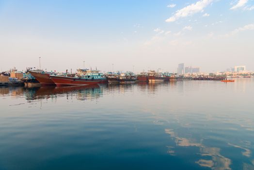 Dubai Creek port with traditional dhows wooden boats, United Arab Emirates 