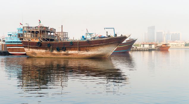 Traditional dhows wooden boat at Dubai Creek wharfage, United Arab Emirates 