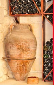 Antique jug and bottles of wine