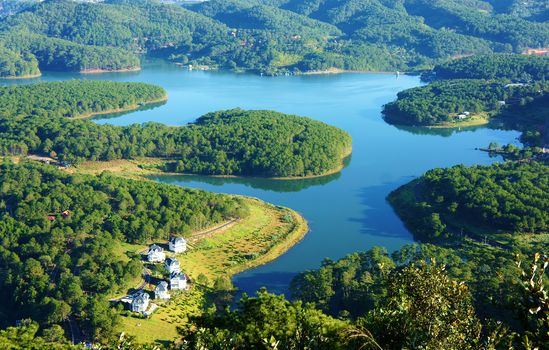 Fantastic landscape of eco lake for travel at Dalat, Viet Nam, fresh atmosphere, villa among forest, impression shape of hill and mountain from high view, wonderful vacation for ecotourism in spring 